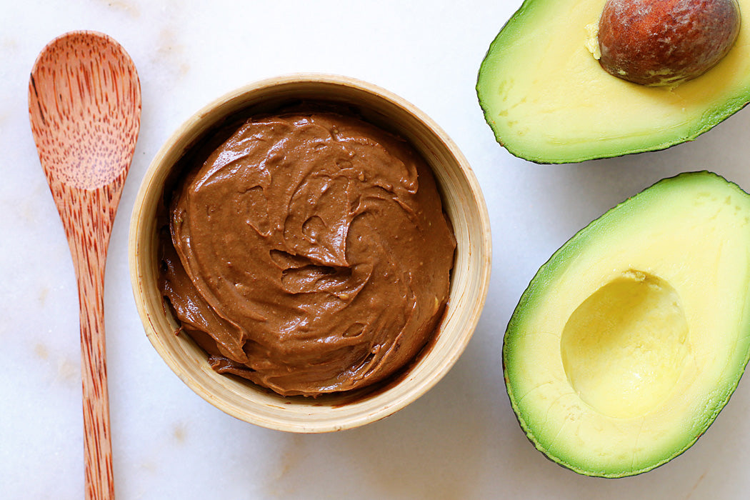 Chocolate Maca Pudding in bowl with avocados