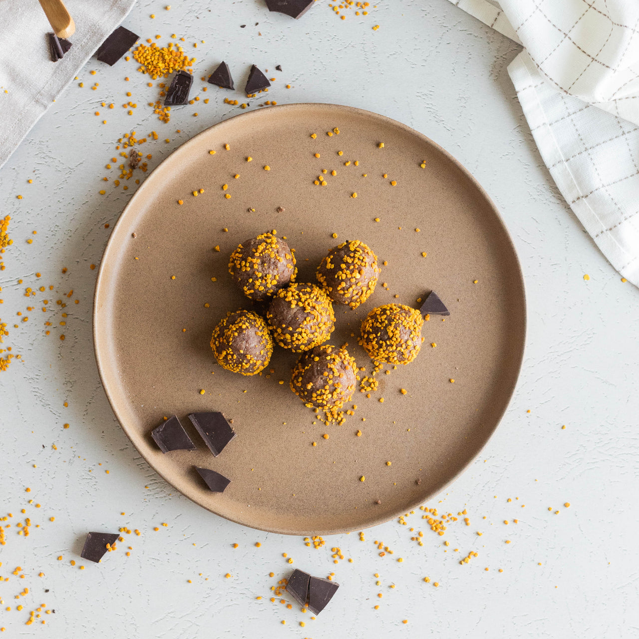 Bee Pollen Brownie Bites on brown plate