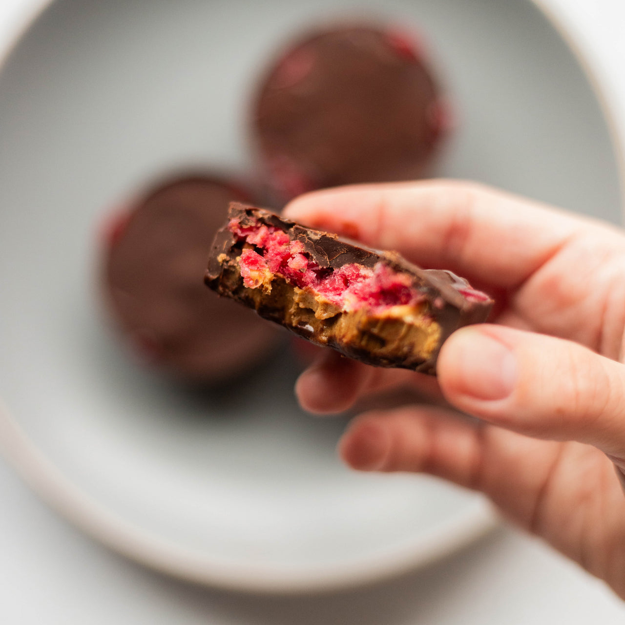 Peanut Butter and Jelly Protein Bites in Hand