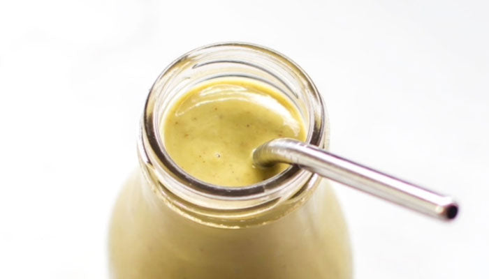 Mango Matcha Smoothie in bottle with straw
