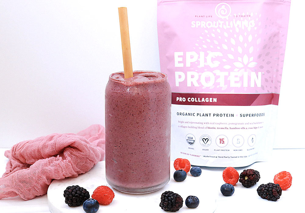 Very Berry Collagen Smoothie in glass with straw and berries