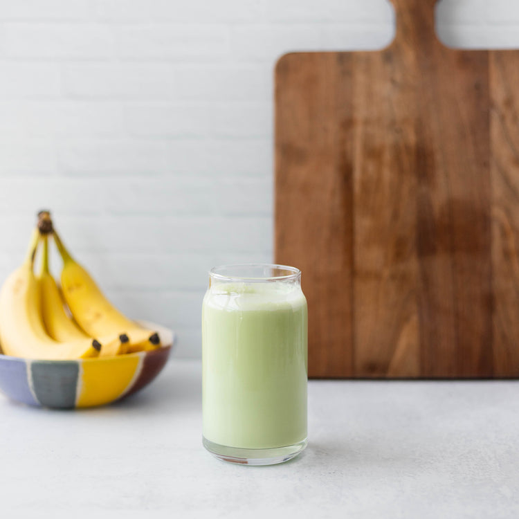 Smoothie with Pumpkin Seed Protein and Bananas in Kitchen
