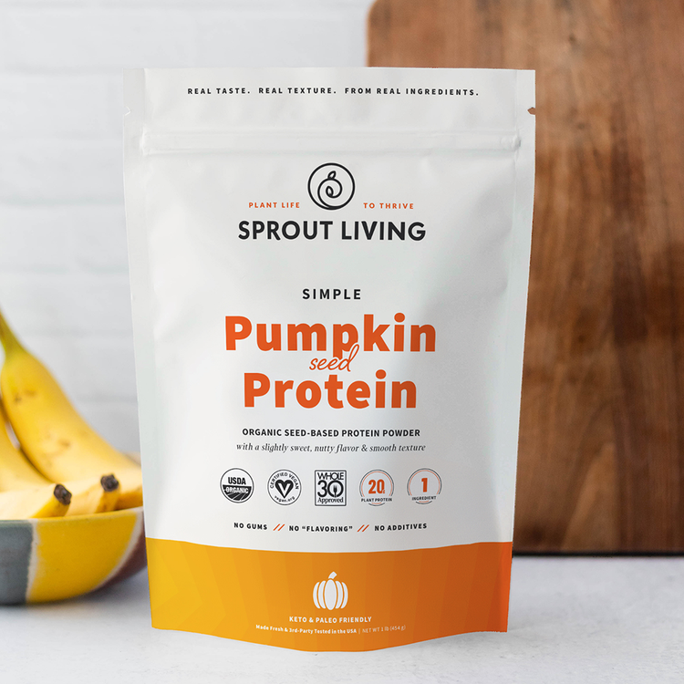 Sprout Living pumpkin seed protein package with bananas in the background