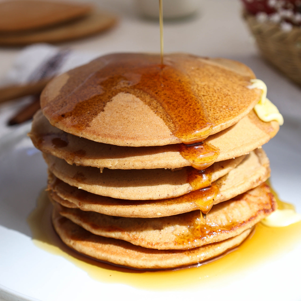 Apple Cider Pancakes With Syrup on Plate