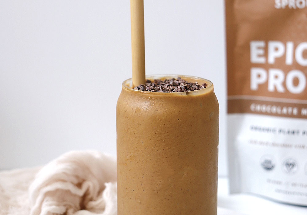 Chocolate Sweet Potato Smoothie in glass with straw