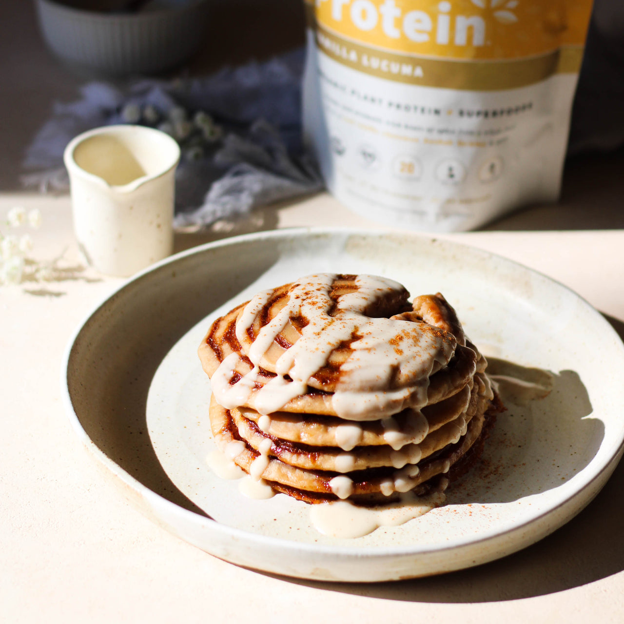 Cinnamon Roll Protein Pancakes on Plate