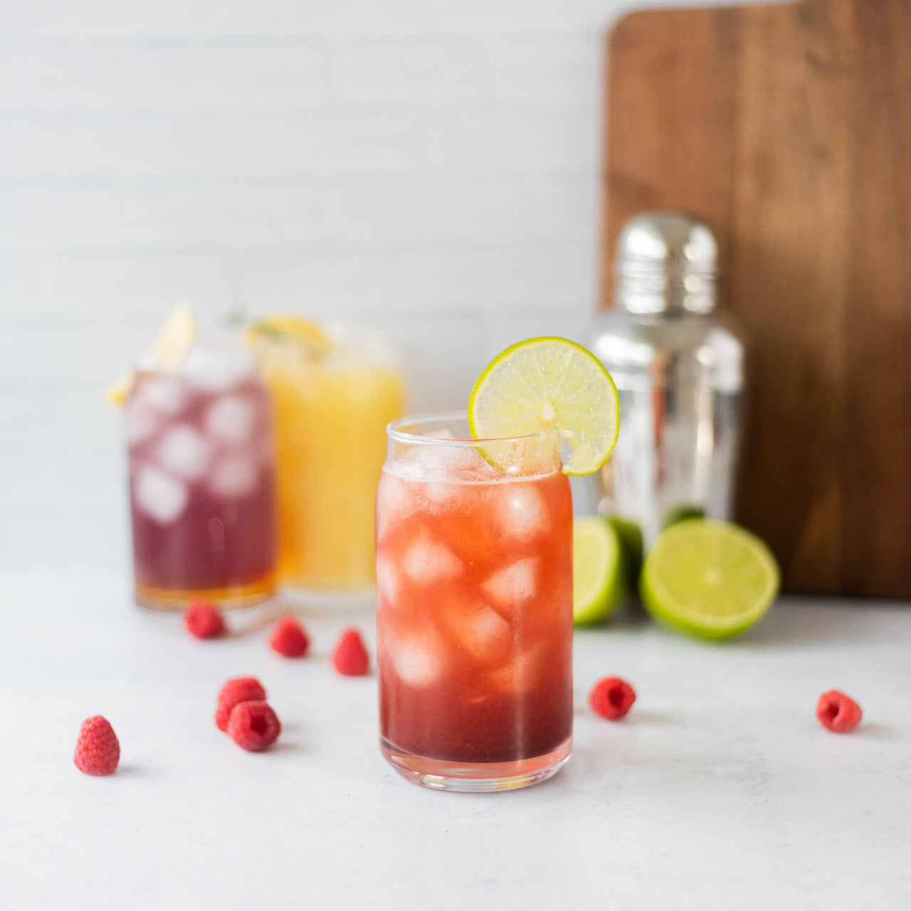 Raspberry Lime Fizz in glass with fruit
