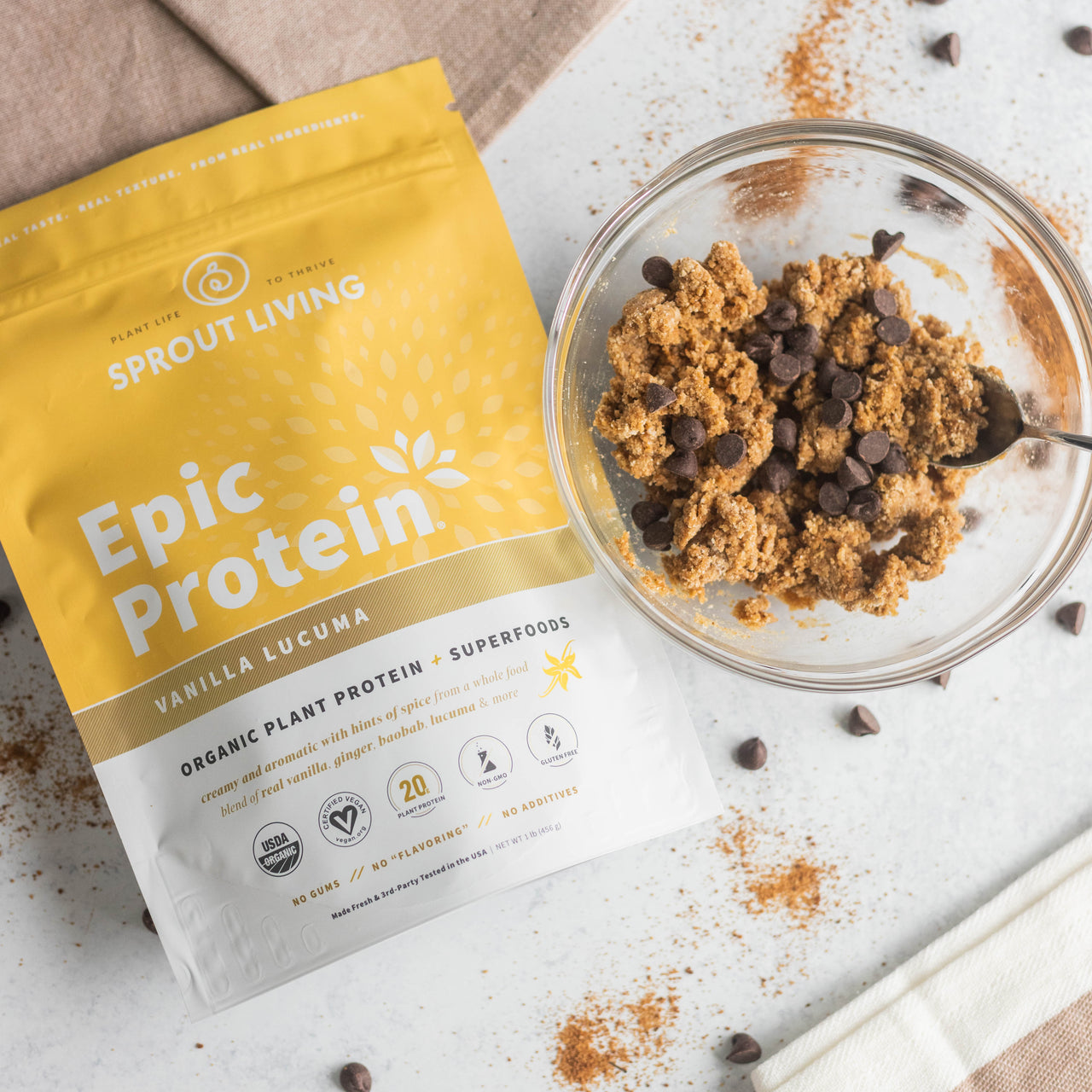 Protein-Packed Cookie Dough in bowl with Epic Vanilla Lucuma 1lb bag
