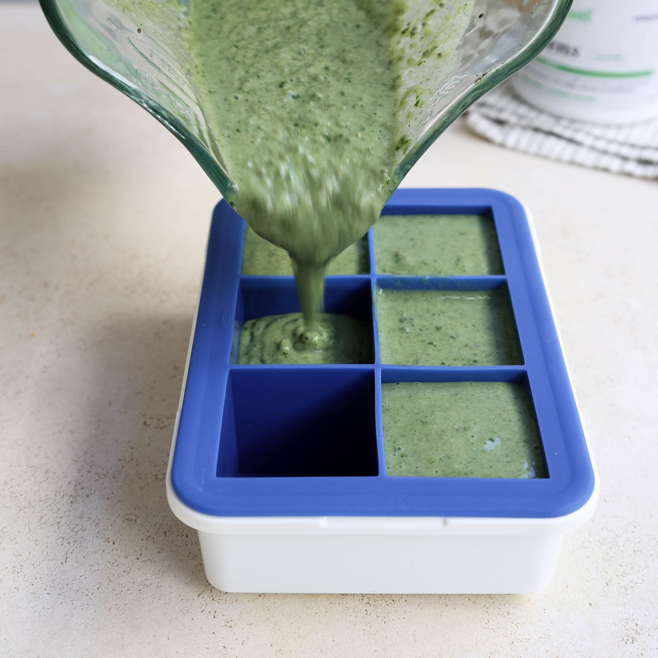 Green Smoothie Cubes Poured From Blender