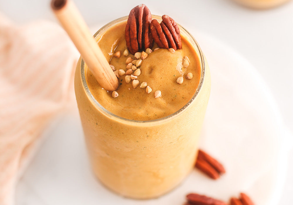 Pumpkin Pie Vanilla Smoothie in glass with straw