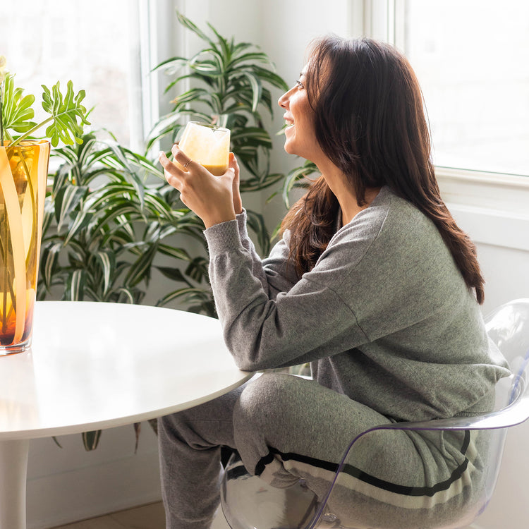 Girl Drinking Epic Protein Vanilla Lucuma Smoothie at Table