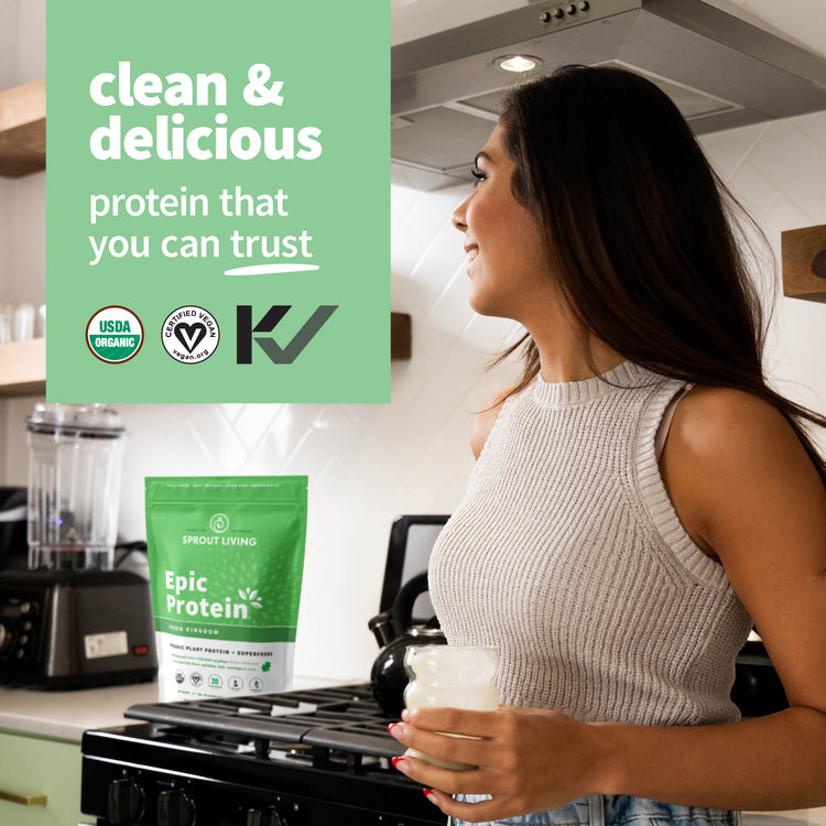 Girl In Kitchen With Smoothie and Epic Protein Green Kingdom