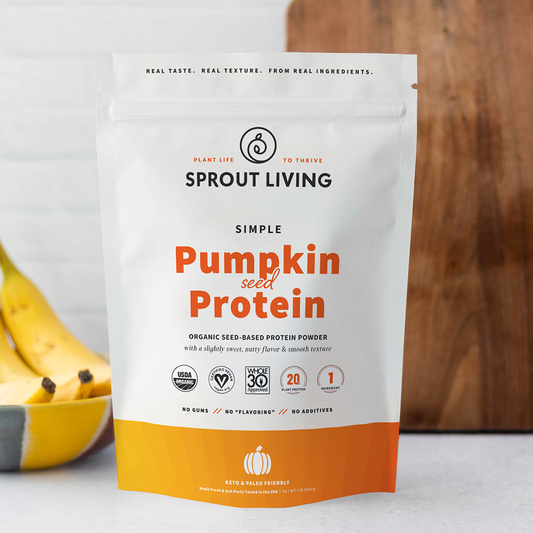 Sprout Living pumpkin seed protein package with bananas in the background