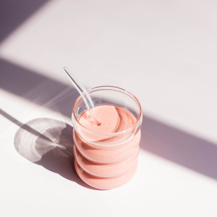 Pink smoothie with straw